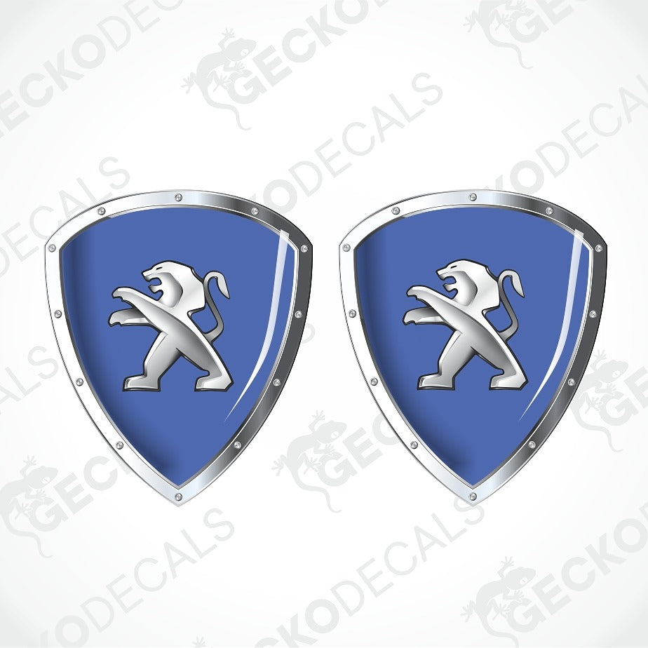 Two identical blue and silver shield-shaped decals with a white lion rampant emblem, shown on a light gray background with diagonal watermark text.