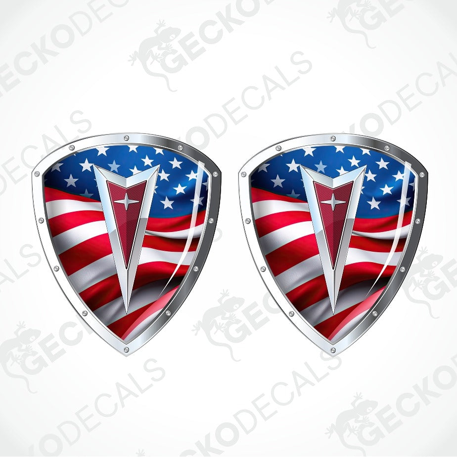 Two identical shield-shaped decals featuring a waving American flag design with a red and silver central emblem, shown on a light gray background with a faint GECKODECALS watermark.