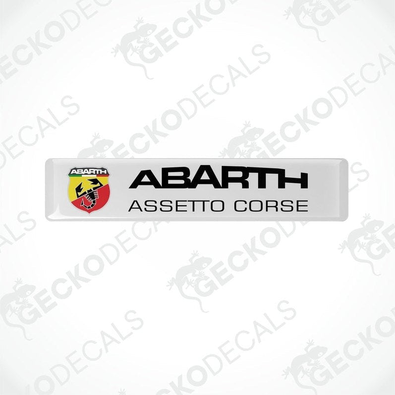 White rectangular vinyl decals with 'ABARTH ASSETTO CORSE' text and Abarth logo in red and yellow.