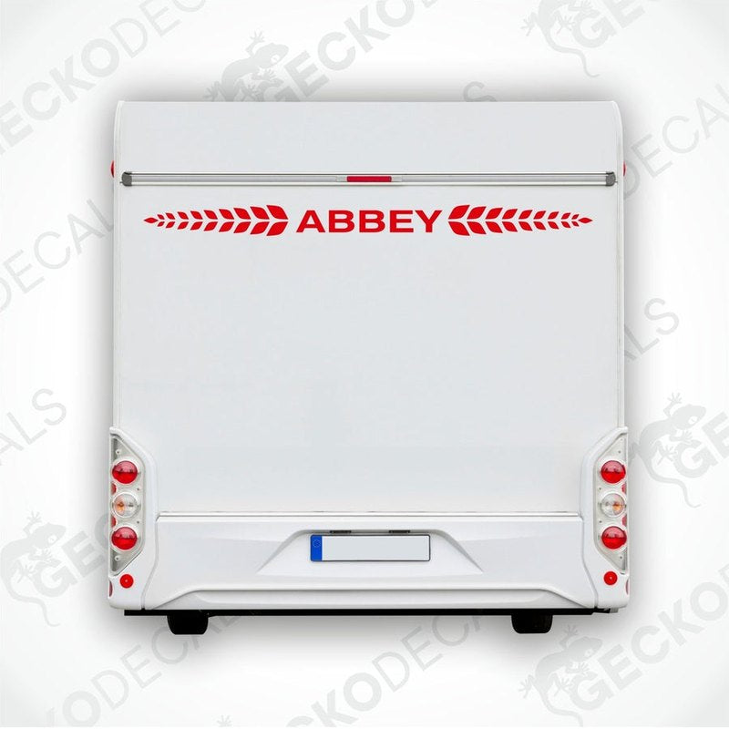 Red Abbey caravan rear decal applied to white caravan door with wreath motif