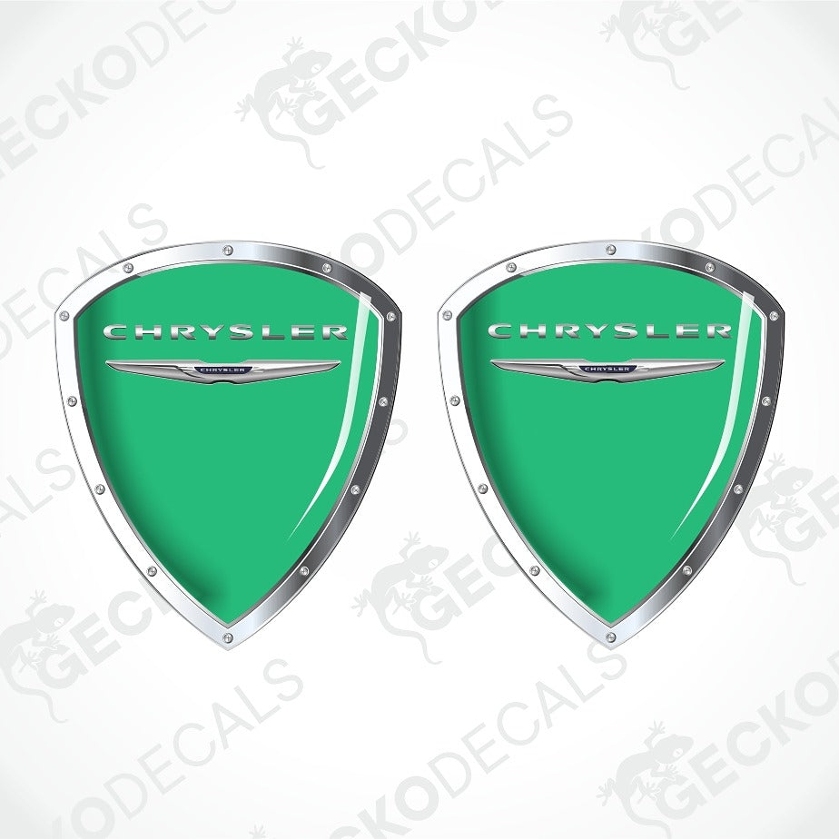 Two green Chrysler shield-shaped decals with silver borders and the Chrysler logo, shown on a white background with diagonal watermark text.