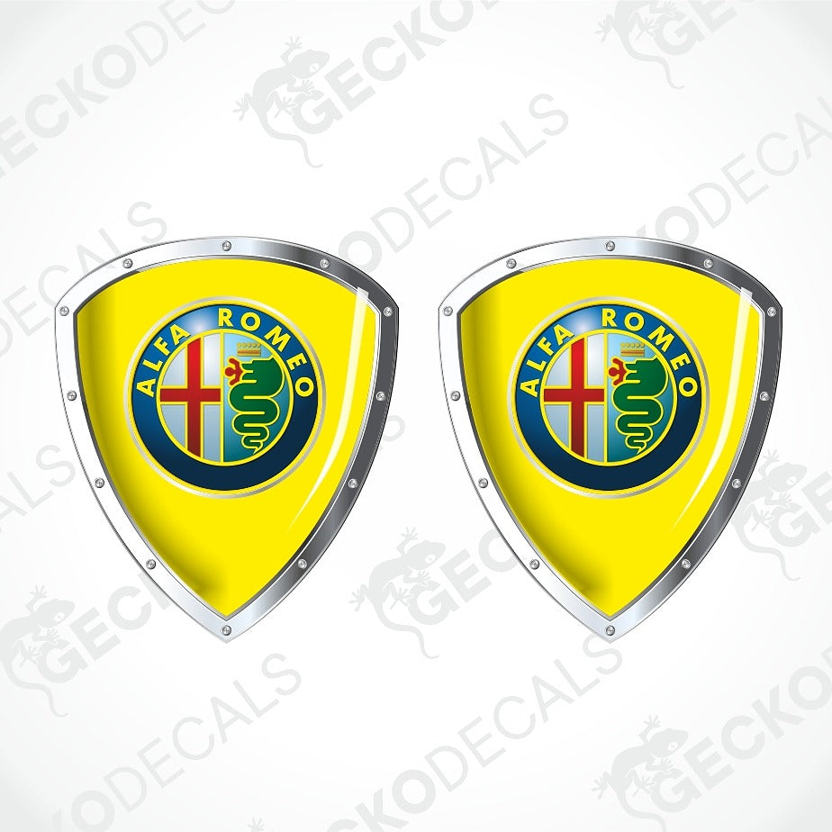 Two identical yellow Alfa Romeo shield-shaped decals with silver borders and the circular Alfa Romeo crest, shown on a white background with faint Geekode watermarks.