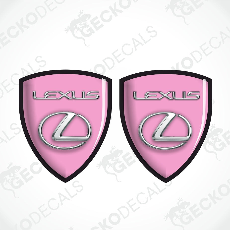 Two pink Lexus shield-shaped decals with black borders, silver Lexus lettering, and the Lexus logo, shown on a white background with diagonal watermarks.