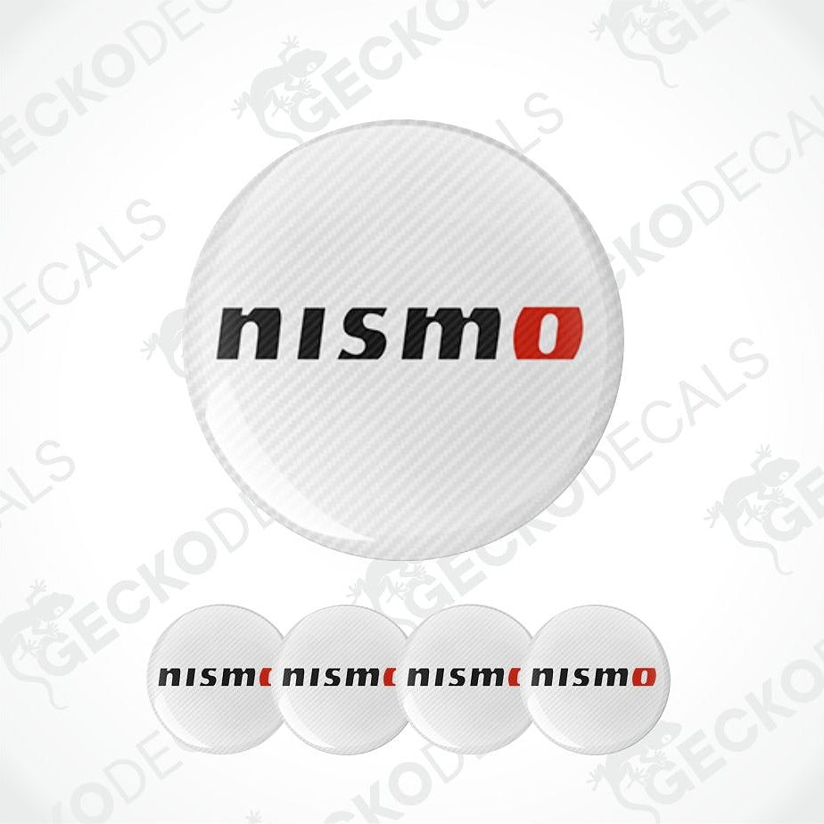 A set of circular Nismo decal stickers, featuring a large carbon-fiber-textured sticker with the 'nismo' logo in black and red, and four smaller solid white stickers with the 'nismo' logo printed in black and red, shown against a light gray background with diagonal watermarks.