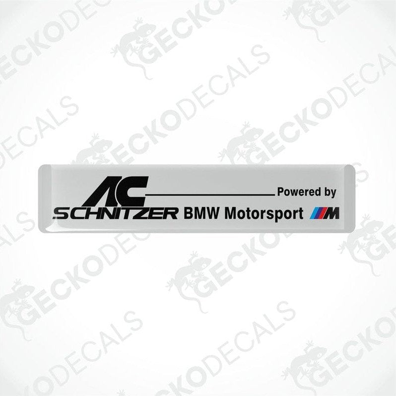 White vinyl decals with black text reading 'AC Schnitzer BMW Motorsport'.
