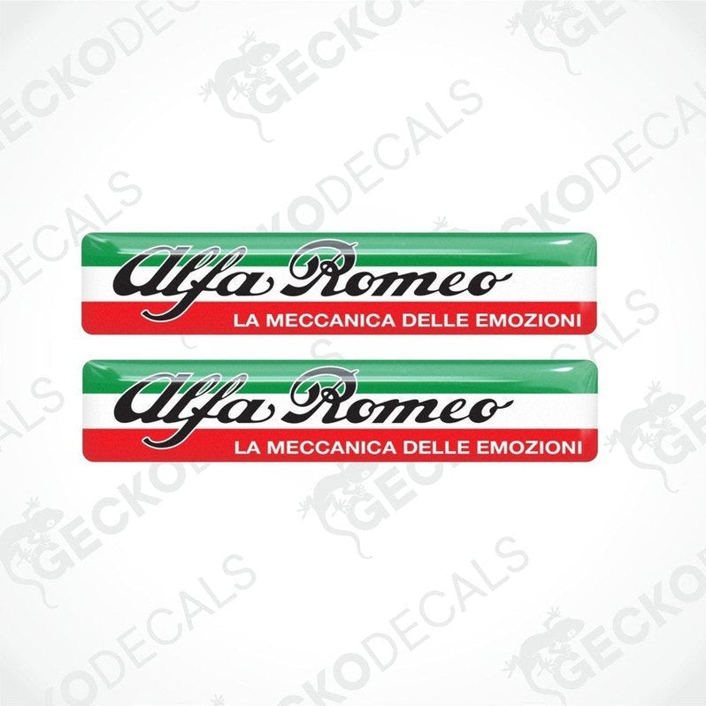 Two Alfa Romeo branded vinyl decals with red, white, and green color scheme and text 'LA MECCANICA DELLE EMOZIONI'.