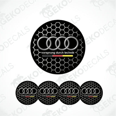 A set of black and silver Audi rings wheel decals with a honeycomb pattern and the 'Vorsprung durch technik' slogan.