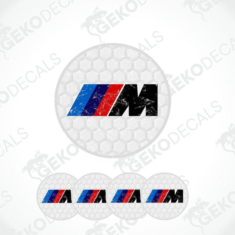 A set of four vinyl decals with polyurethane coating featuring the BMW M logo in WHITE, red, and blue on a honeycomb pattern background.