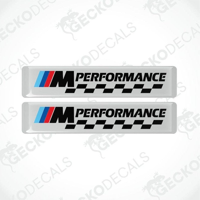 Rectangular vinyl decals with a polyurethane coating featuring the BMW M Performance logo in white, black, red, and blue colors.