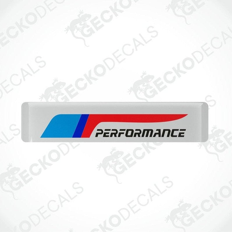 White vinyl stickers with red and blue geometric patterns and the text 'PERFORMANCE' on a black background.