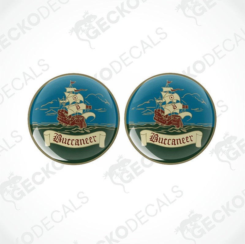 Two round epoxy decals with a pirate ship and the word 'Buccaneer' printed on them.