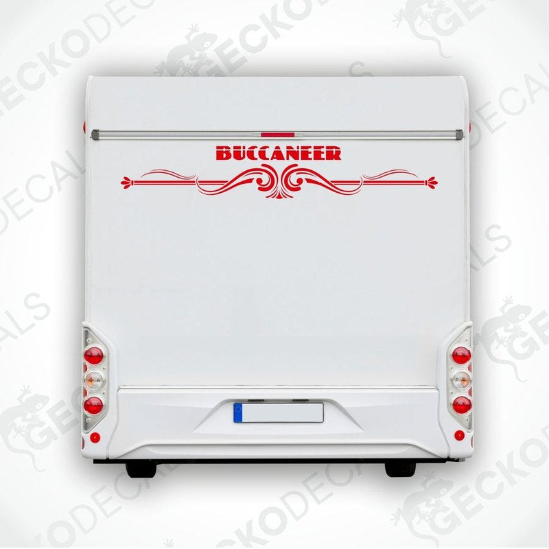 A die cut sticker depicting the word 'BUCCANEER' in capital letters, placed on the rear of a white vehicle, surrounded by red decorative elements.
