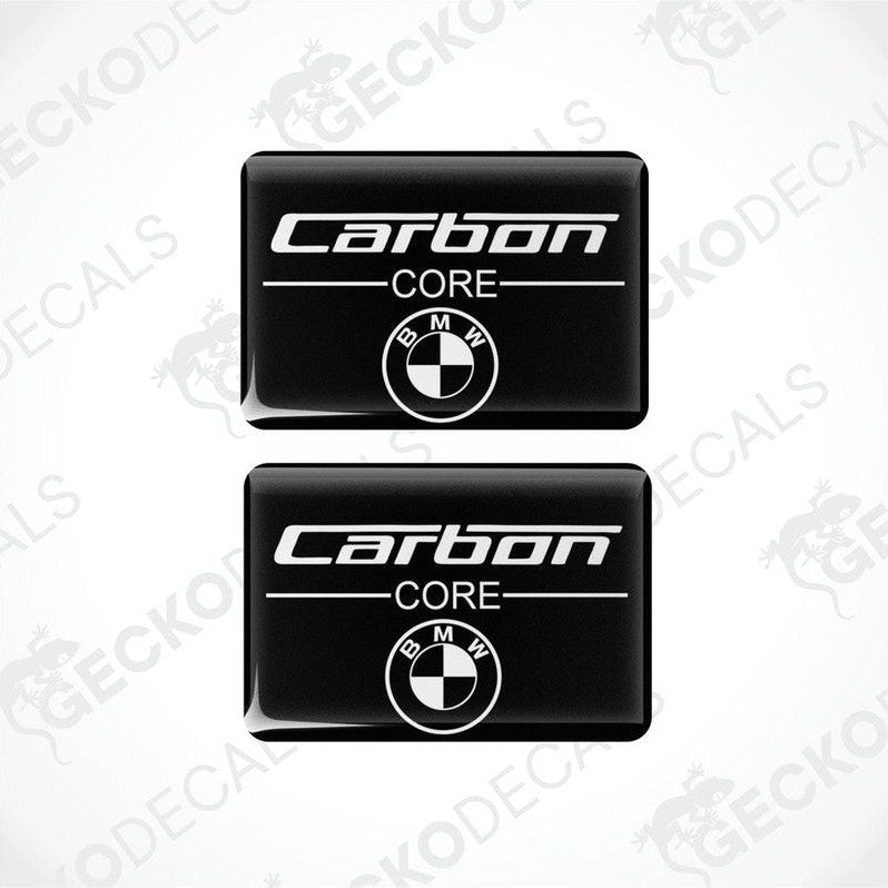 Two rectangular car decals with the words 'Carbon CORE' and the BMW logo