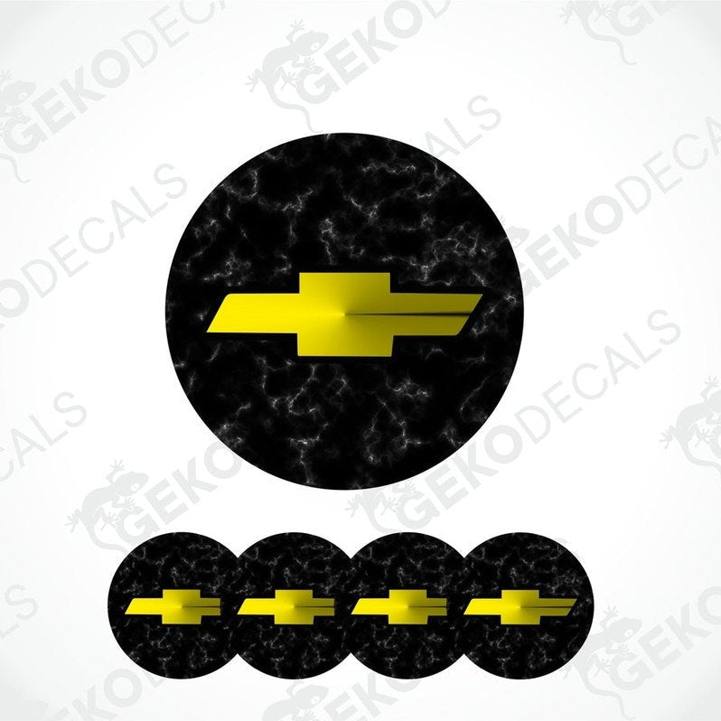 A set of four black vinyl stickers with a yellow chevrolet logo, designed for use on car wheels or caps.