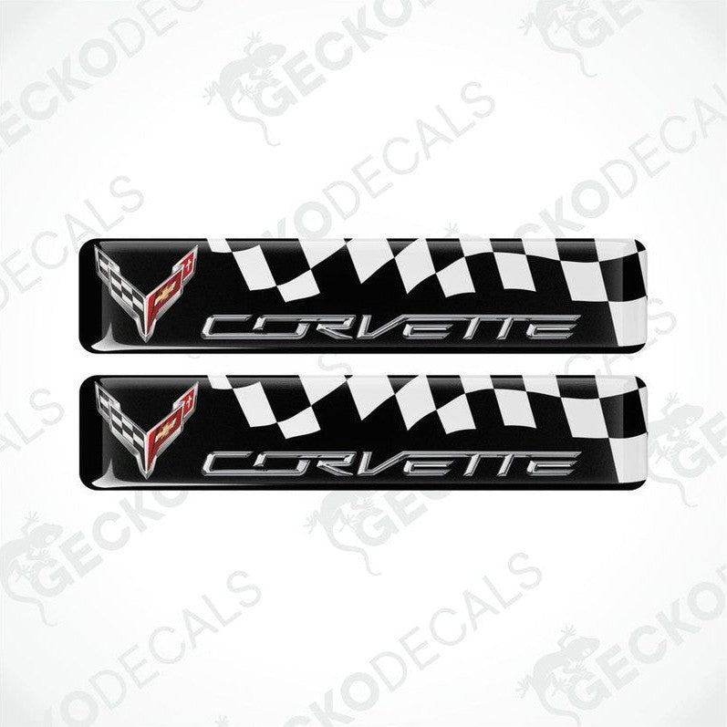 A pair of black, white, and red vinyl decals with a polyurethane coating featuring the Chevrolet Corvette logo.
