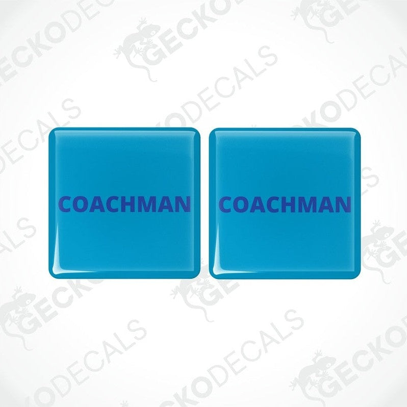Two blue vinyl stickers with the word 'COACHMAN'