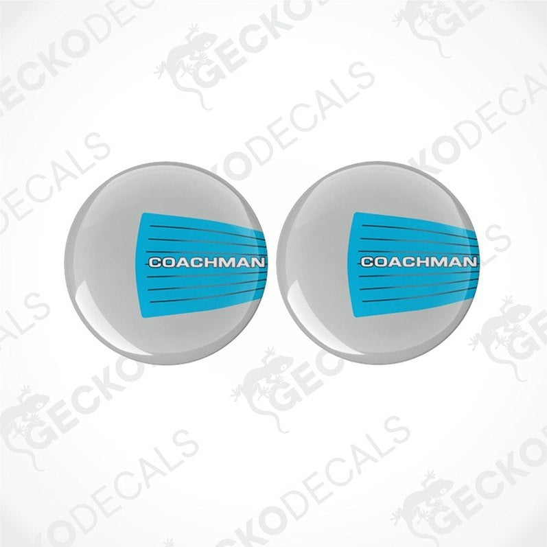 Two round vinyl decals with a blue and white 'COACHMAN' branding, placed on a white background.