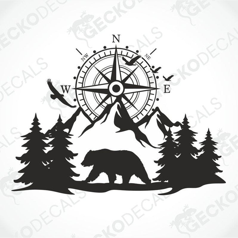 A black decal of a compass with bear and trees on the side of a white vehicle.