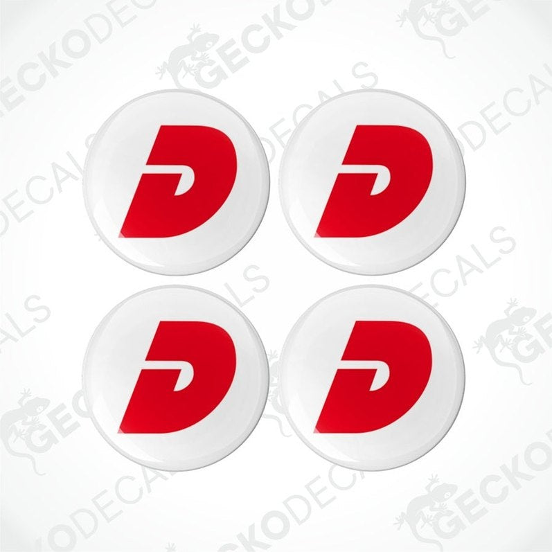 A set of four white round epoxy decals with a red 'D' logo in the center.