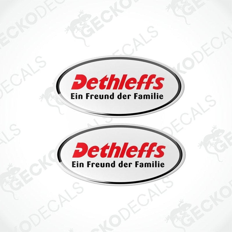 Two round vinyl decals with a red and white 'DETHLEFFS' logo, placed on a white background.