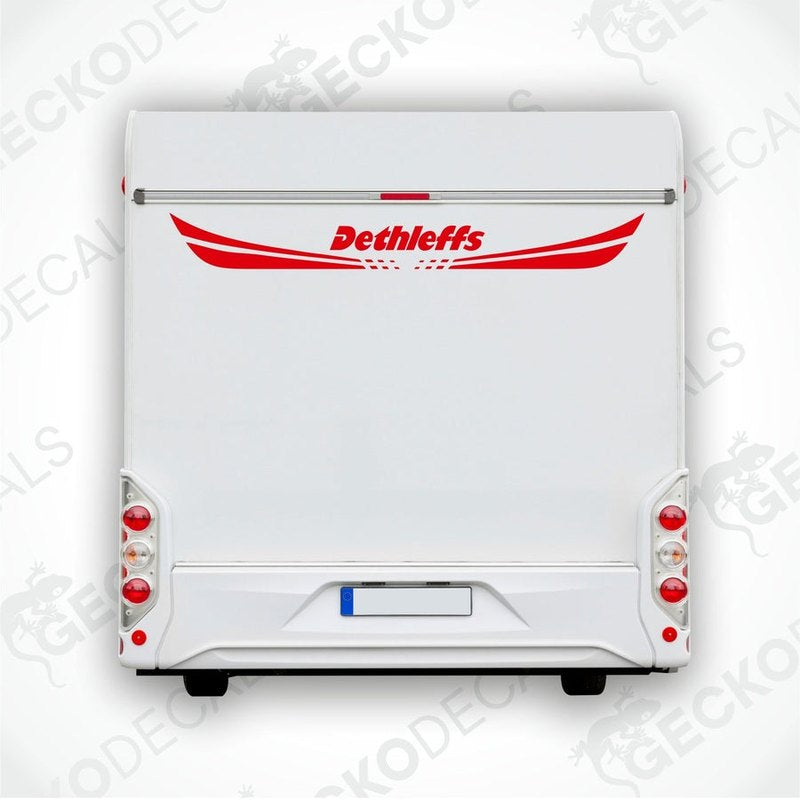 A white caravan with a red 'Dethleffs' decal on the rear side.