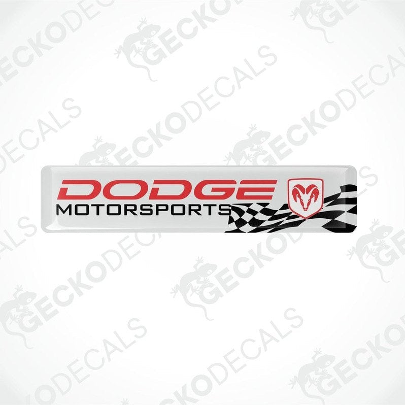 White, red, and black vinyl decals with the text 'DODGE Motorsports' and a checkered design.