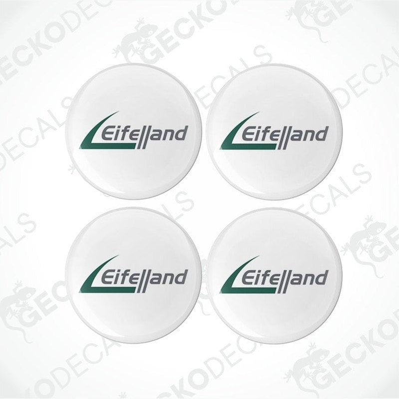 A set of four round white vinyl decals with the Eiffelland logo in green.