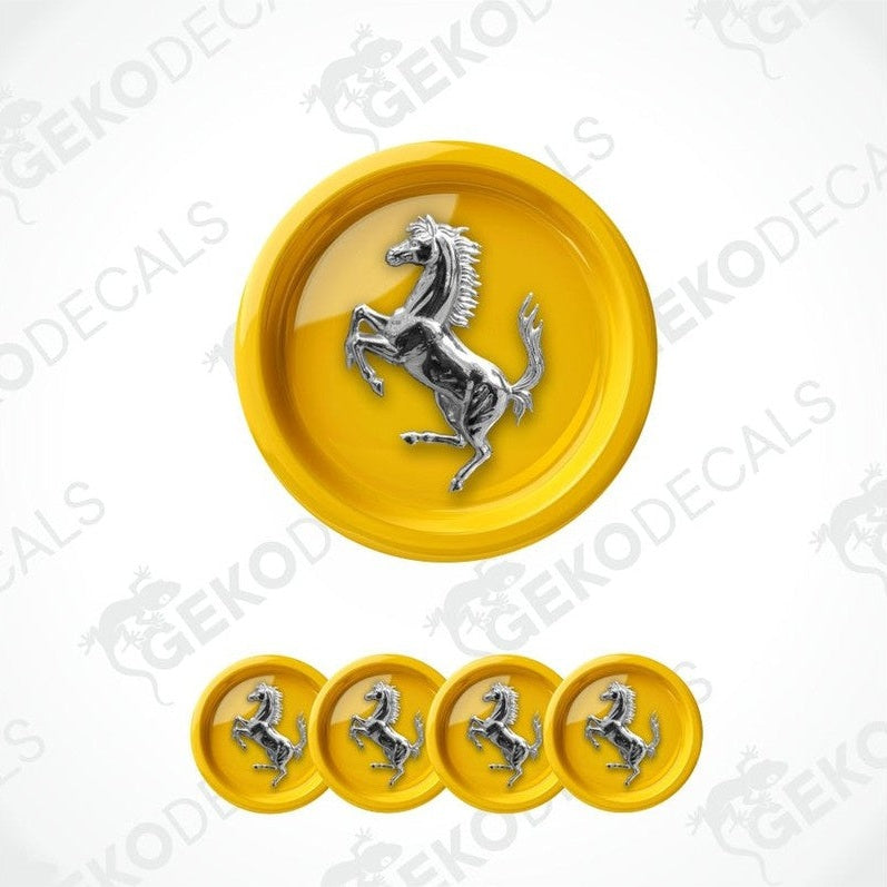 Ferrari logo with yellow background and silver horse emblem on a white background.
