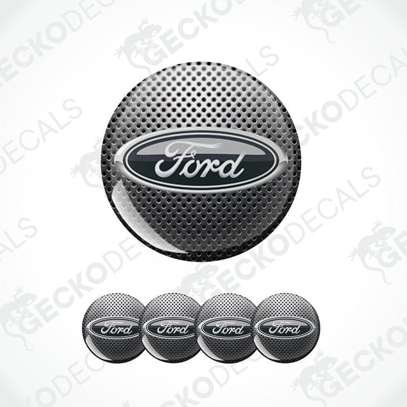 Ford logo car wheel center cap with five additional caps on a white background.