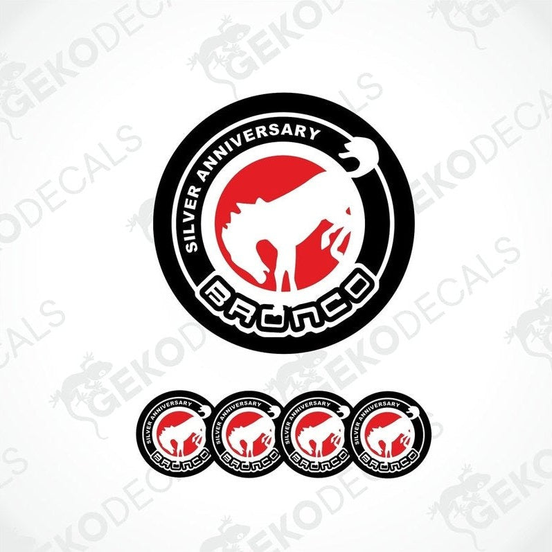 A set of four round vehicle decals featuring the text 'SILVER ANNIVERSARY' and the Ford Bronco logo in red and white on a black background.