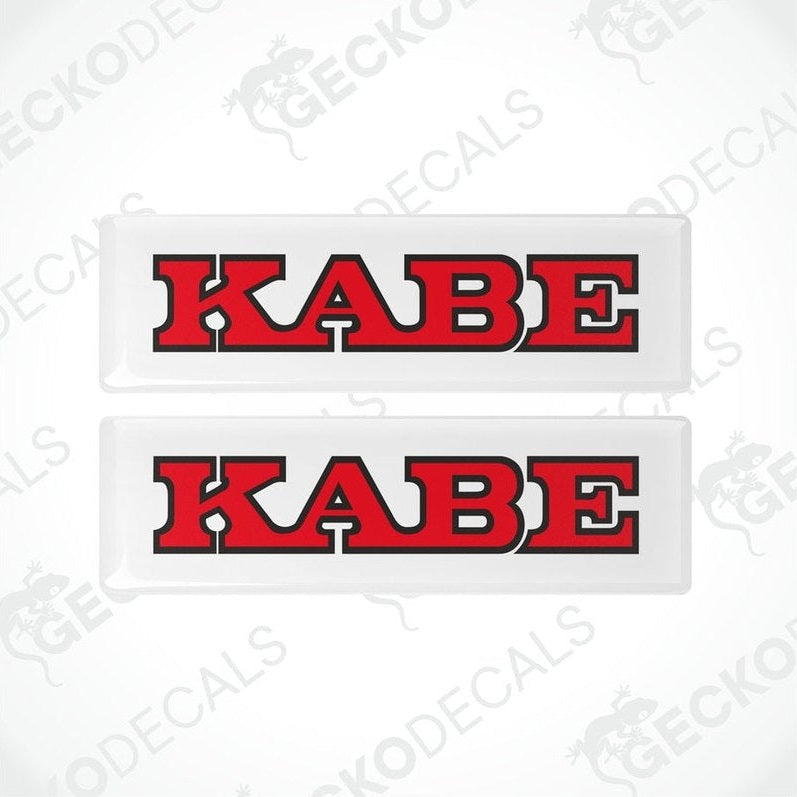 Two red and white car decals with the word 'KABE' printed in bold letters.