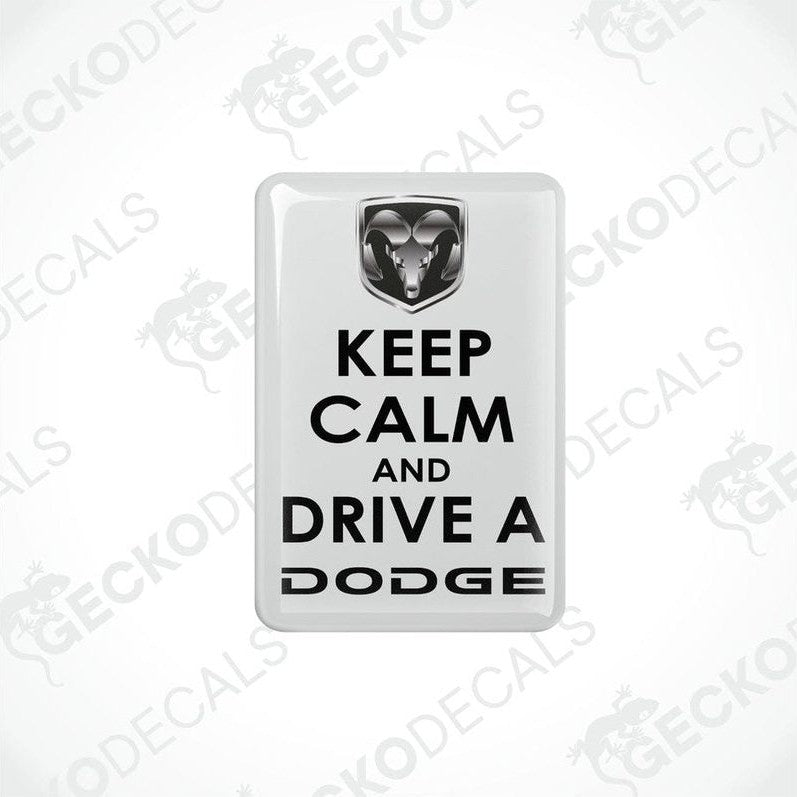White vinyl decals with black text saying 'KEEP CALM AND DRIVE A DODGE' and the Dodge ram logo.
