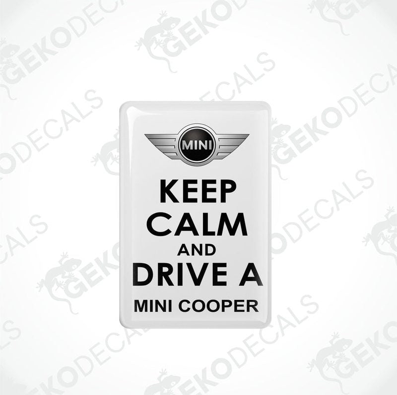 White vinyl stickers with the text 'KEEP CALM AND DRIVE A MINI COOPER' and the MINI COOPER logo in the center.
