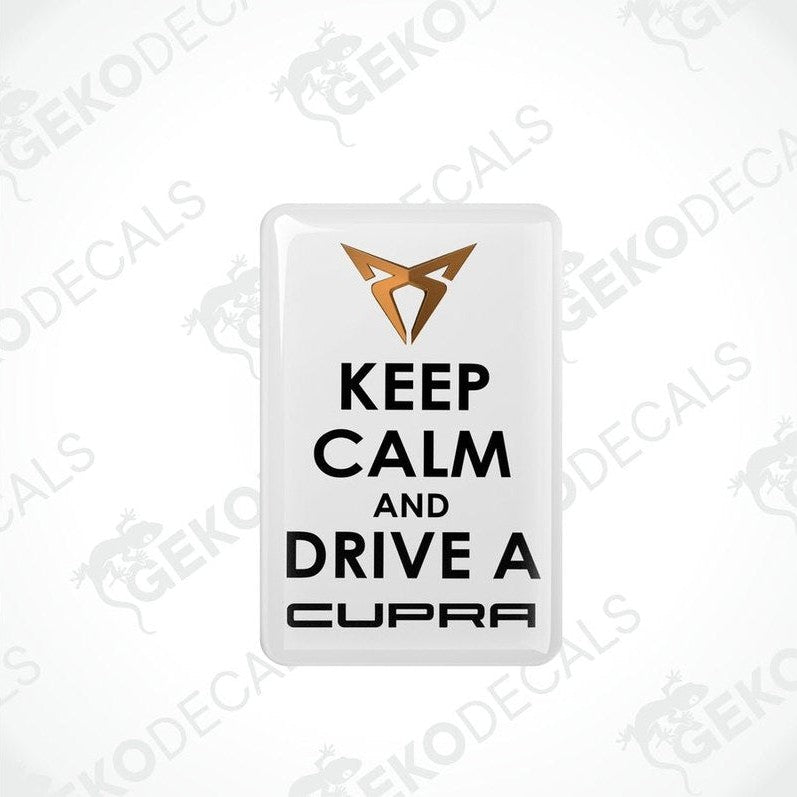 Rectangular withe vehicle decals with black text saying 'KEEP CALM AND DRIVE A SEAT CUPRA'