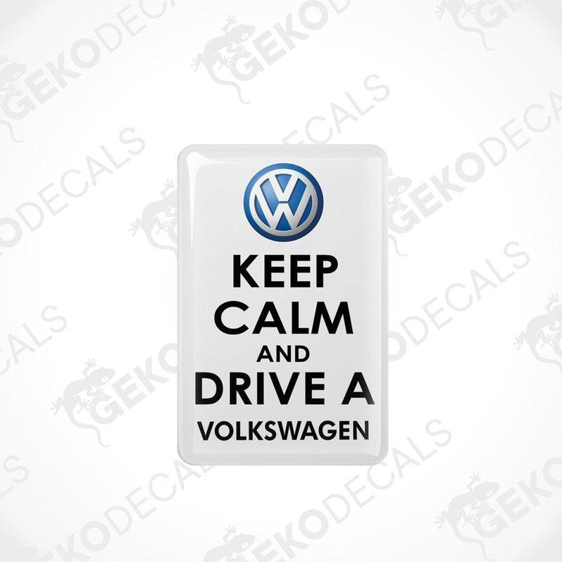 Withe vinyl stickers with the text 'KEEP CALM AND DRIVE A VOLKSWAGEN' and a VOLKSWAGEN logo on them.