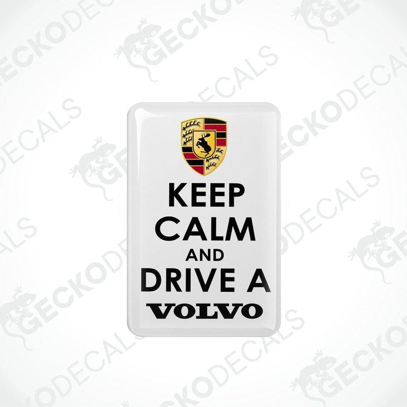 Withe vinyl stickers with the text 'KEEP CALM AND DRIVE A VOLVO' and a Volvo logo on them.