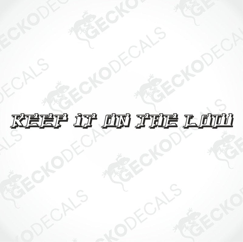 A decal with the text 'KEEP IT ON THE LOW' positioned on the windscreen of a gray truck.