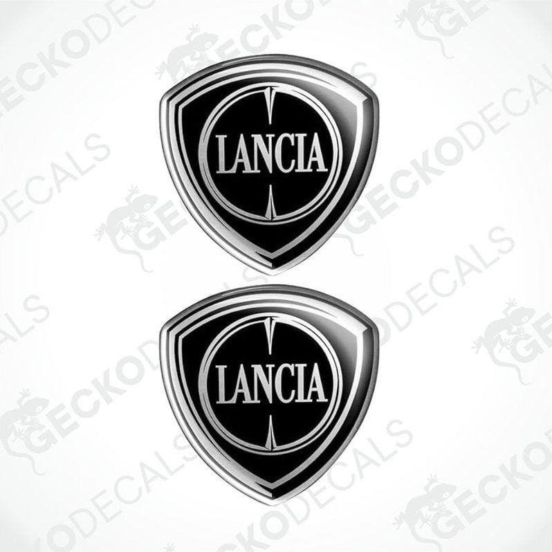 Two silver and black vinyl decals with the LANCIA brand logo.