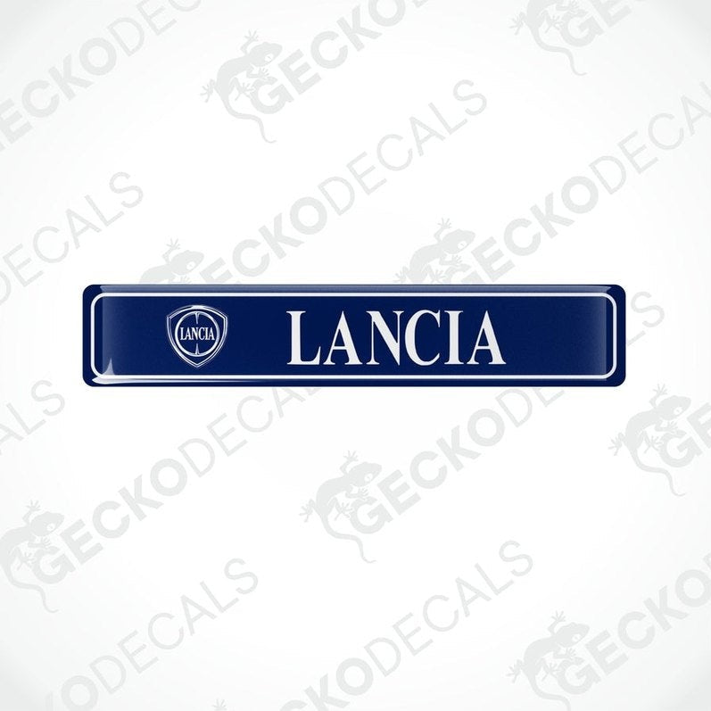 Blue vinyl stickers with 'LANCIA' text and a logo, placed against a white background.