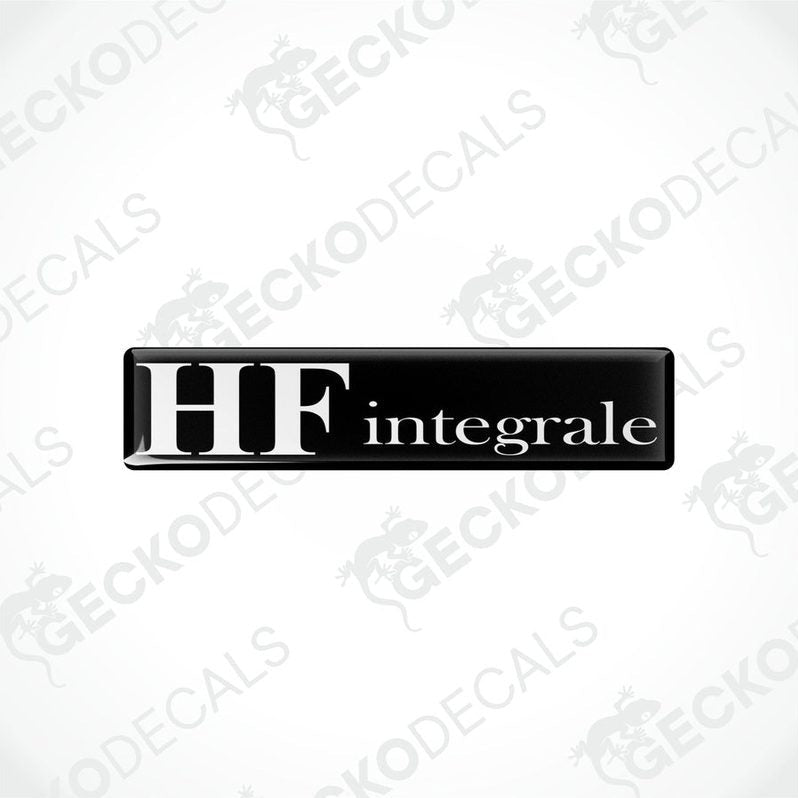 Rectangular black vinyl decals with the word 'LANCIA HF INTEGRALE' written in white letters.