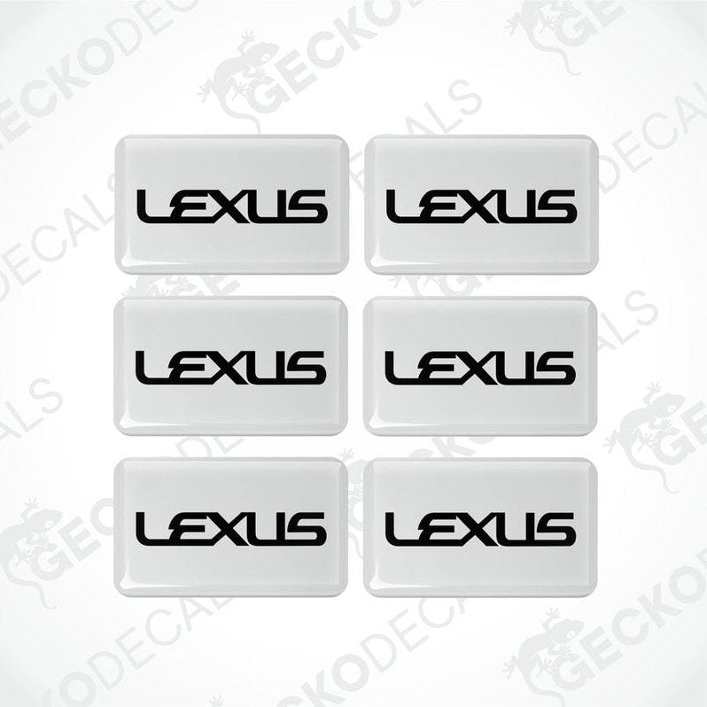 A set of six white vinyl stickers with the LEXUS brand logo.