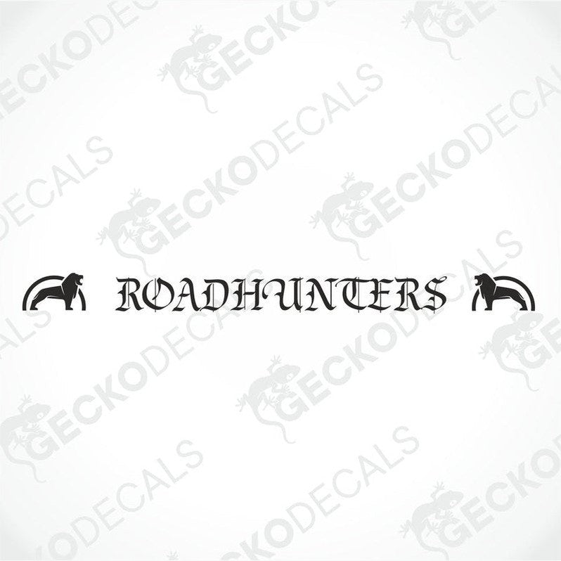A die cut decal with the text 'ROADHUNTERS' displayed on the front windscreen of a gray truck. The decal is positioned in the upper part of the windshield.