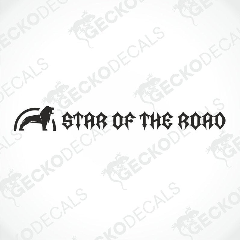 A die cut decal with the text 'STAR OF THE ROAD' displayed on the windshield of a gray truck.