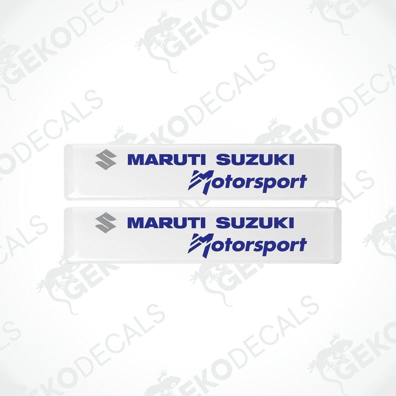 Two white vinyl stickers with the MARUTI SUZUKI logo and the slogan 'MOTORSPORT' printed in blue .