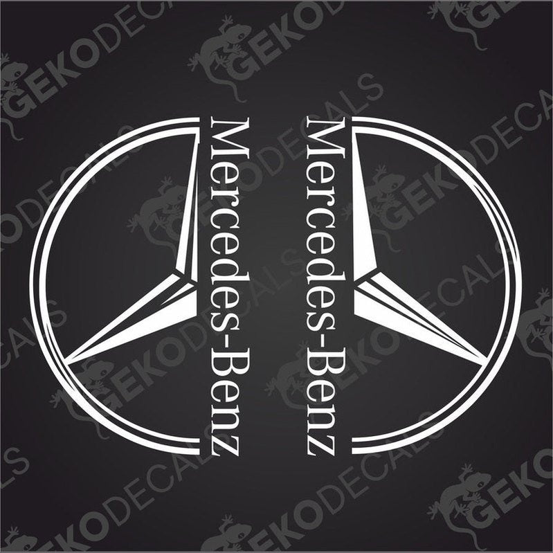 Two black and white decals of the Mercedes-Benz logo, one for the front left and one for the front right, on a dark background.