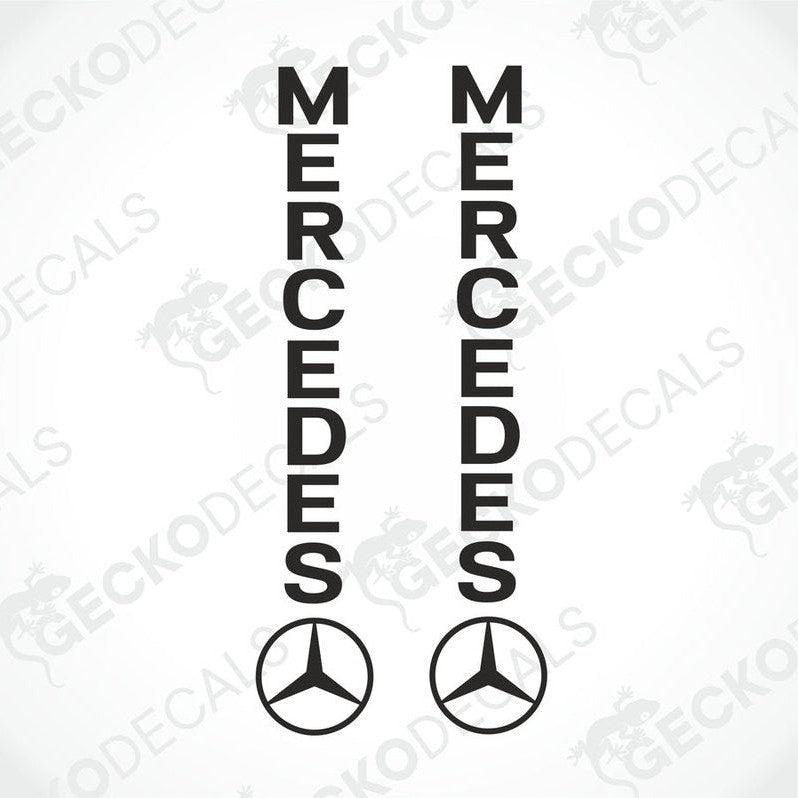 Two black decals with the word 'MERCEDES' on each, with the Mercedes-Benz logo in the center of each decal.