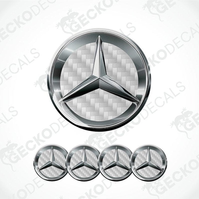 Spacious dark silver metallic Mercedes Benz logo, white carbon shines from the inside