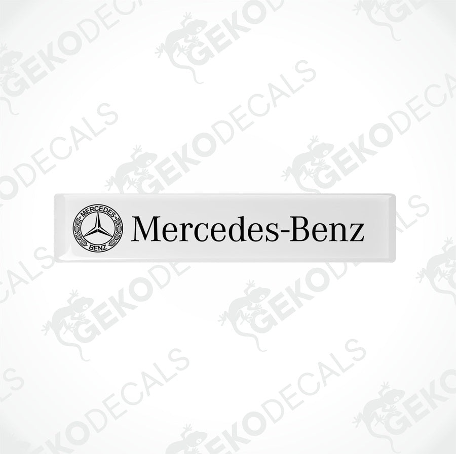White vinyl stickers with the Mercedes-Benz logo printed on them.