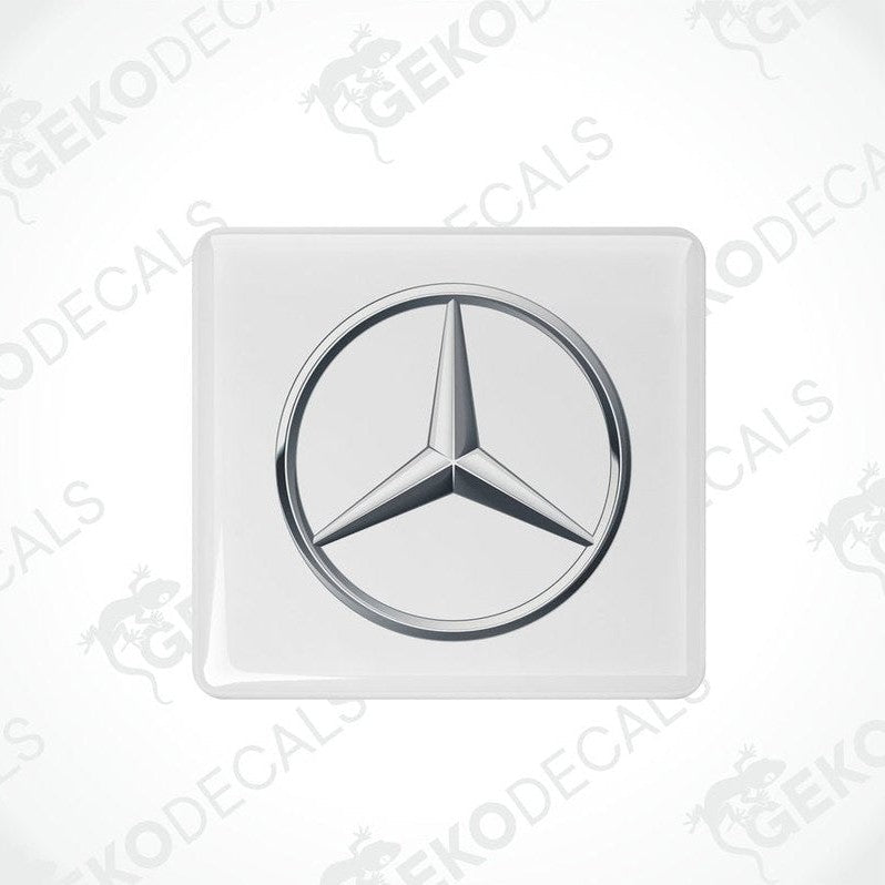 Single Mercedes-Benz silver domed epoxy car sticker on gray