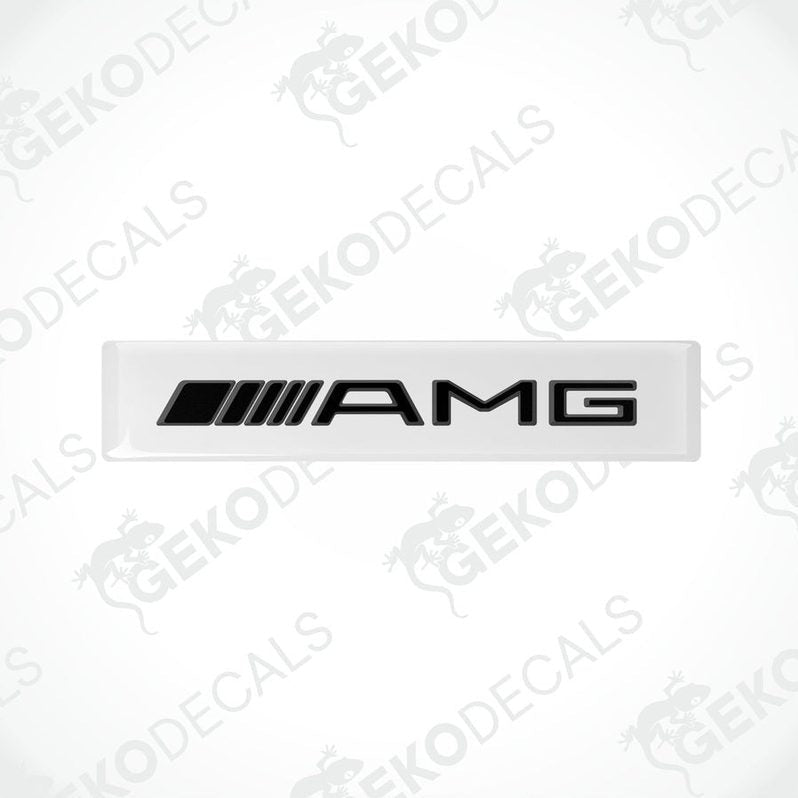White vinyl stickers with the Mercedes-Benz AMG logo on a black background.